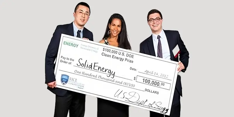 Dr. Qichao Hu and team holding a $100,000 check awarded by the U.S. Department of Energy-sponsored Clean Energy Prize